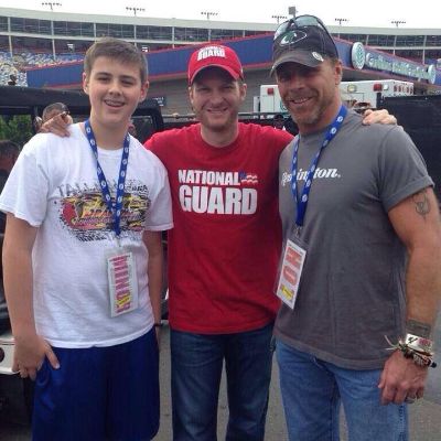 Dale Earnhardt Jr. is between Shawn Michaels and Cameron Kade Hickenbottom in the picture.